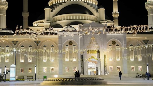 Muslims perform Tarawih prayers at the Millet Mosque, the second largest mosque in Turkey, which is