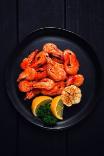 Fried shrimp, on a black background, top view, no people