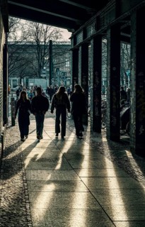 Passers-by below the S-Bahn overpass at Hakeschen Markt, Berlin, Germany
