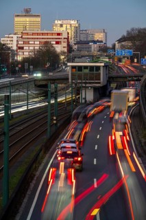 Motorway A40, Ruhr expressway, heavy traffic jam, rush hour, city passage in Essen, skyline of the