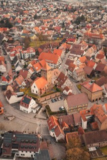 Bird's eye view of densely packed roofs and historic buildings of a city center, Ötisheim,