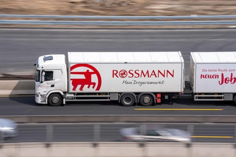 Freight truck for food logistics, on the motorway, Rossmann drugstore chain
