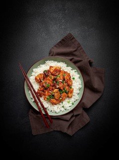 Fried chicken teriyaki with rice, green onion and sesame, homemade, no people