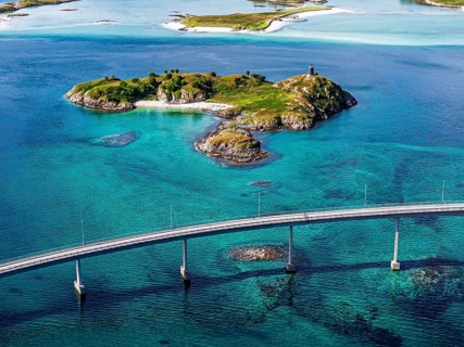 Sommaroy Bridge connecting Kvaloya Island to Sommaroy Island, small islands, turquoise water,