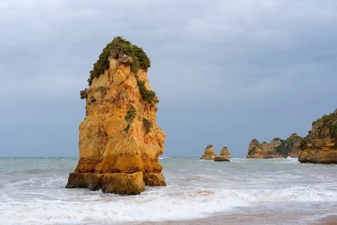 Rocks on the coast in the surf, Praia Dona Ana, Lagos, Algarve, Portugal