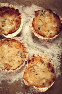 Scallop shells, stuffed, baked with cheese, in the oven, julienne with scallops