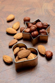 Nuts and cookie cutters, almonds and hazelnuts