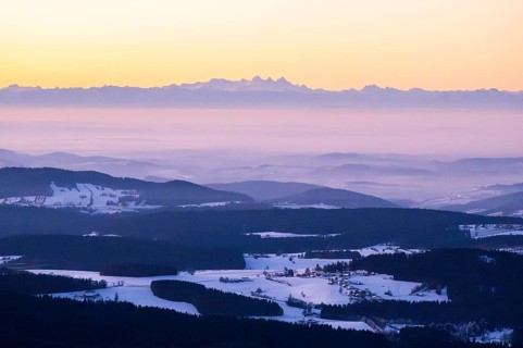View from Mount Lusen over the hills of the bavarian forest at sunrise in winter, Bavaria, Germany