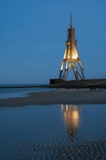 Illuminated spherical beacon with reflection, landmark, blue hour, North Sea, Lower Saxony Wadden