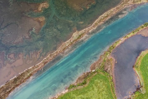 Aerial view of the wetlands and streams in San Vicente de la Barquera, Cantabria, Spain, showcasing