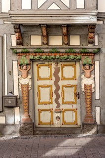 House Ohlschlaeger, historic half-timbered house of the Baroque period, portal with atlases, putti