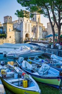 Boats in front of Castello Scaligero, Sirmione, Lombardy, Italy