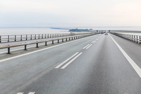 Highway over the Storebelt Bridge, view of the artificially enlarged island of Sprogø and the West