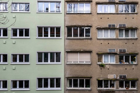 Windows, gray house facades, a house is renovated, renovation, modernization, contrast, difference,