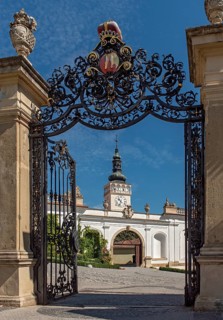Tower of Church of St. Wenceslaus seen through iron gate of Mikulov Castle gardens, Czech Republic