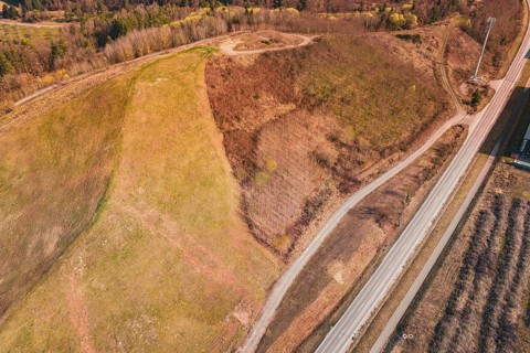 View of a sublime landscape with roads and fields, partly surrounded by forests, old deposit in