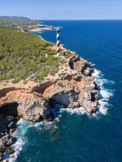 Aerial view of the lighthouse Far de sa Punta des Moscarter, Ibiza, Balearic Islands, Spain