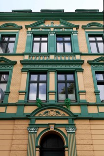 Renovated residential building in Wilhelminian style, decorative façade, old building property,