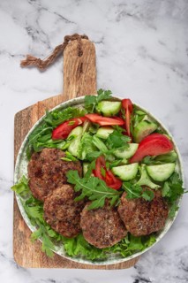 Fried cutlets, mixed minced meat, with vegetable salad, homemade, top view, no people