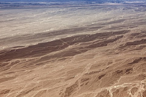 Aerial view of an extensive desert area with distinctive textures and patterns, The landscape and