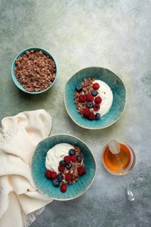 Breakfast, two bowls, yogurt, muesli with berries, and honey, homemade, no people