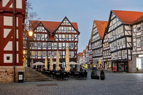 Quiet square with half-timbered houses and cafés as the evening sets in, The old town centre of
