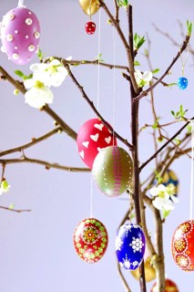 Easter, Easter bouquet with colorful Easter eggs, branches with flowers of an ornamental quince,
