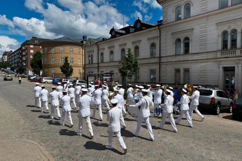 Musicians in white uniforms, military band roaming the streets of Karlskrona, Götaland, Blekinge,