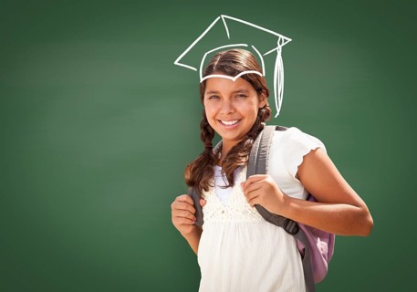 Young Hispanic Student Girl Wearing Backpack Front Of Blackboard with Fireman Helmet Drawn In Chalk