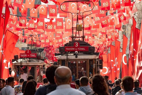 Istanbul, Turkey. October 29th 2023 Crowds flock between the many flags in Istiklal Street,