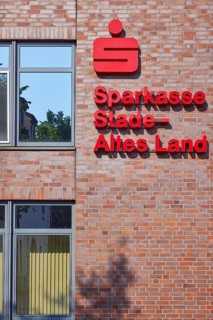Logo and lettering of Sparkasse Stade-Altes Land on the facade of the branch in Stade, Hanseatic