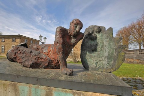 Sculpture The Warrior by Markus Lüpertz 1993, bronze sculpture, modern art, overthrown lying
