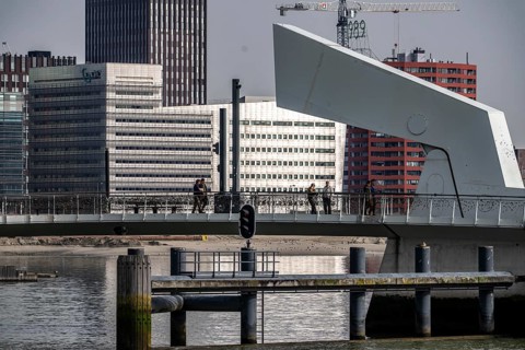 The Rijnhaven bridge over the Rijnhaven harbor basin at Kopf van Zuid, Wilhelminapier at Hotel New