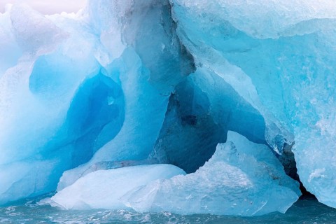 Blue ice wall of Idabreen, Ida glacier calving into Liefdefjorden at Idabukta bay, Haakon VII Land,