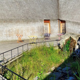 Different coloured folding tables, courtyard at Naturum Takern Visitor Center, modern architecture,