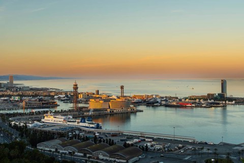 View of the old harbour and the city of Barcelona in the evening light, Spain