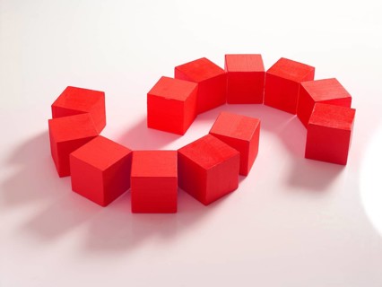 12 red wooden cubes against a white background