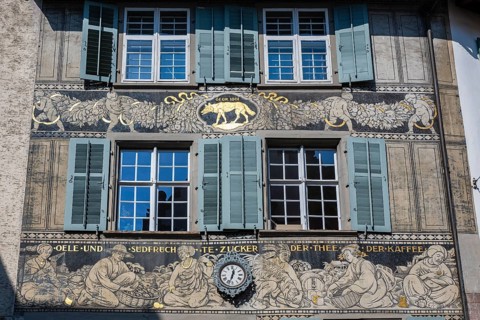Detailed view of the historic Haus zum Wolf in Basel's Spalenberg district with detailed façade