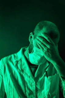 A doctor working with great sorrow in the coronavirus pandemic, Covid-19