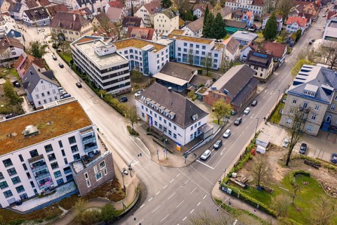 Dense urban landscape with a central road junction and surrounding residential and commercial