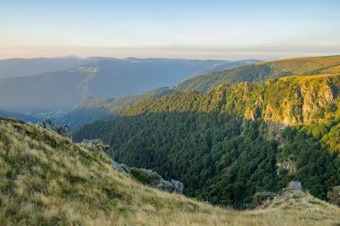 The first rays of sunshine at Mount Hohneck in the Vosges Mountains, France