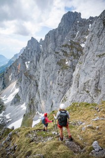 Mountaineer with helmet on a hiking trail, Wilder Kaiser, Kaiser Mountains, Tyrol, Austria