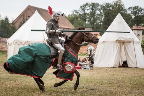 LUBIAZ, POLAND - AUGUST 25, 2018: Monastery Siege - historical staging. Knights horse riding show