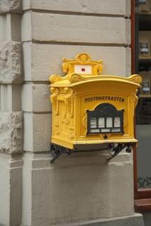 Historic yellow post box in Limburg, Hesse, Germany