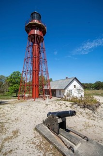 Sandhammaren lighthouse with old cannon that gave sound signal in fog, Ystad municipality, Skåne,