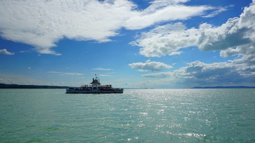 Ferry on a lake under blue sky with clouds, Lake Balaton, Hungary
