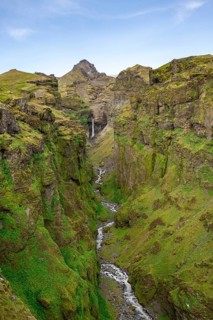 Mountain landscape with green canyon, waterfall and river in Múlagljúfur Canyon, Sudurland, Iceland