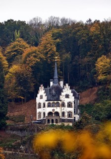 Listed, late historicist villa with stepped gable above the banks of the Rhine in autumn, Remagen,