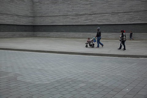 Namely commemoration of the persecution of Jews during National Socialism, pedestrians, gray wall