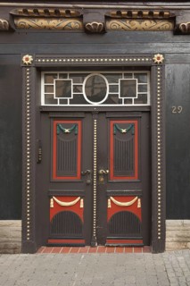 Brown front door with decorations, half-timbered house, house number plate, Burgstraße 29, Hann.